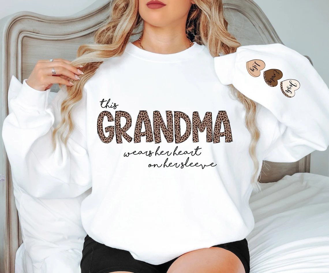 Personalized This Grandma Wears Her Heart on Her Sleeve Sweatshirt, Custom Kids Name on Sleeve, Mothers Day Gift, Gift for Grandma Sweatshirt