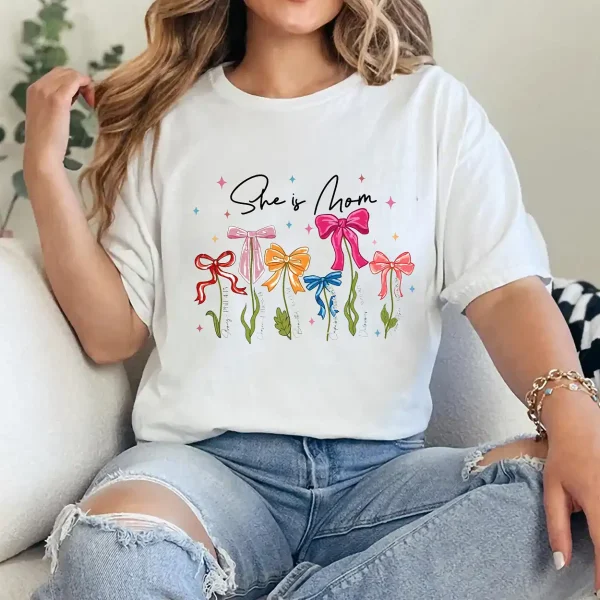 She Is Mom T-Shirt – Retro Coquette Bow Christian Mom Shirt, Bible Verse 'She Is Strong' Tee, Cute Mother's Day Gift for Faithful Mama - Image 3